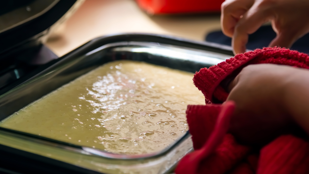 pouring your batter into the cake pan