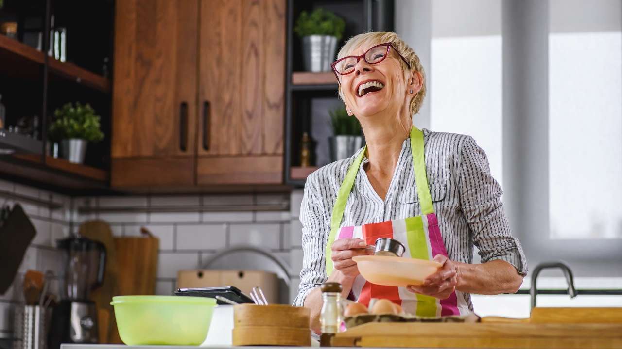woman laughing in kitchen